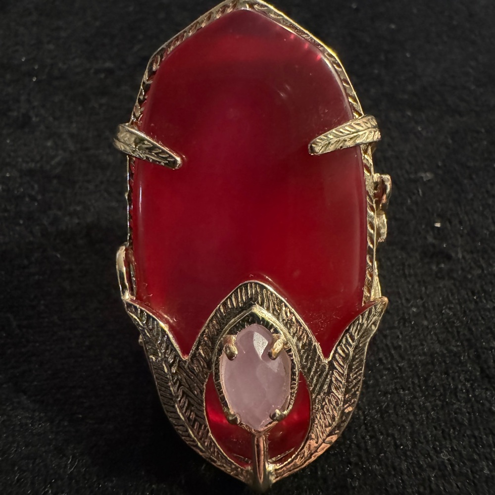 Kendra Scott red stone ring with silver detailed frame and pink center stone
